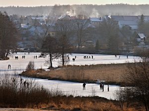 People skating on the river